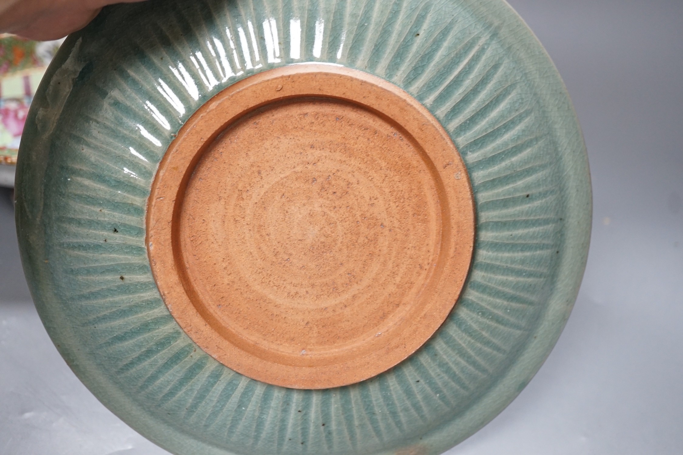 A Chinese famille rose pedestal dish, 23cm, a Thai celadon dish and a blue and white prunus jar and cover.